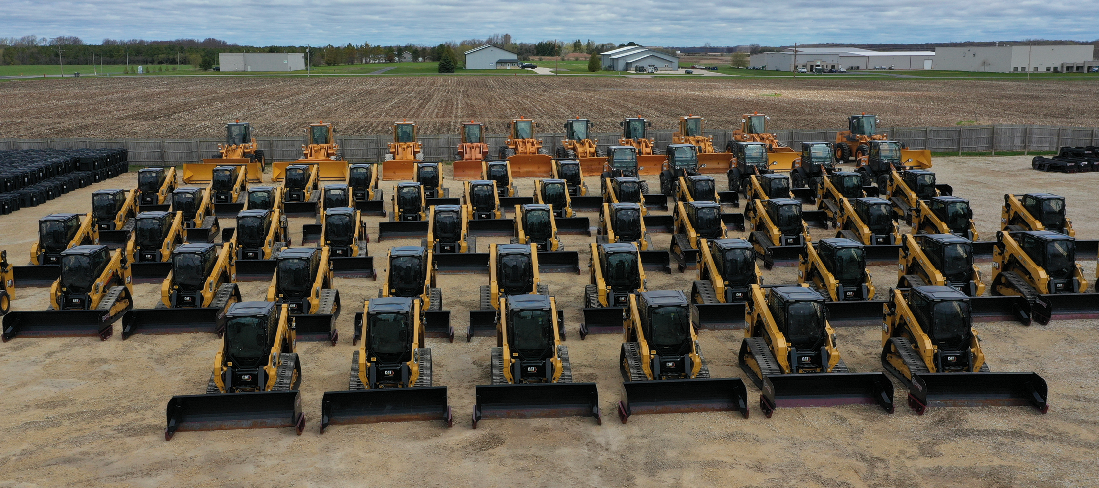 skid steers in rows