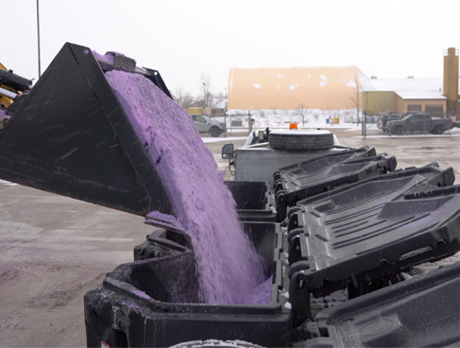 Salt being poured into site tote